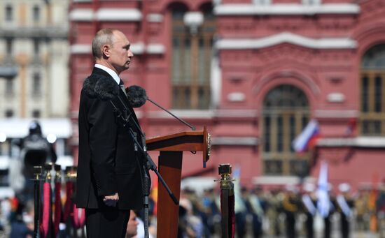 Russian President Vladimir Putin takes part in military parade to mark 75th anniversary of Victory in World War II