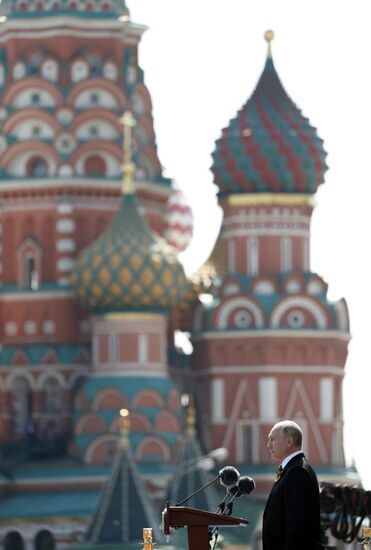 Russian President Vladimir Putin takes part in military parade to mark 75th anniversary of Victory in World War II