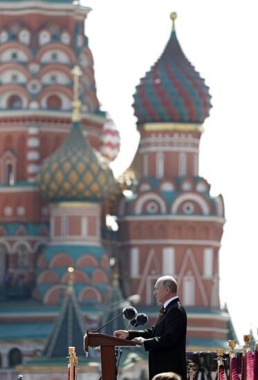 Russian President Vladimir Putin takes part in military parade to mark 75th anniversary of Victory in World War II