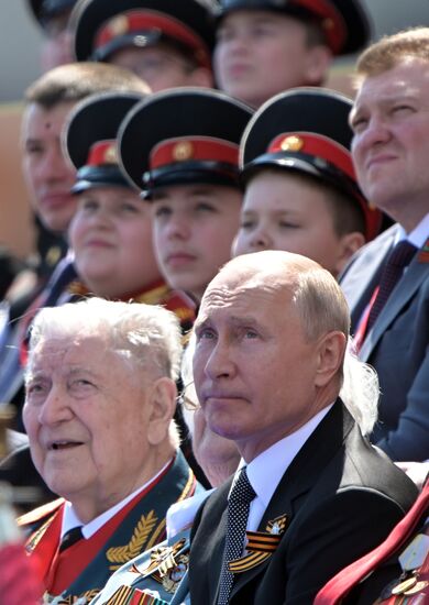 Russian President Vladimir Putin takes part in military parade to mark 75th anniversary of Victory in World War II
