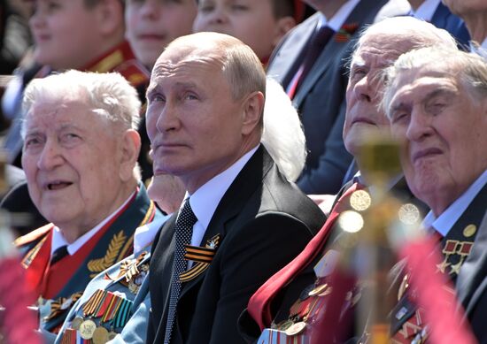 Russian President Vladimir Putin takes part in military parade to mark 75th anniversary of Victory in World War II