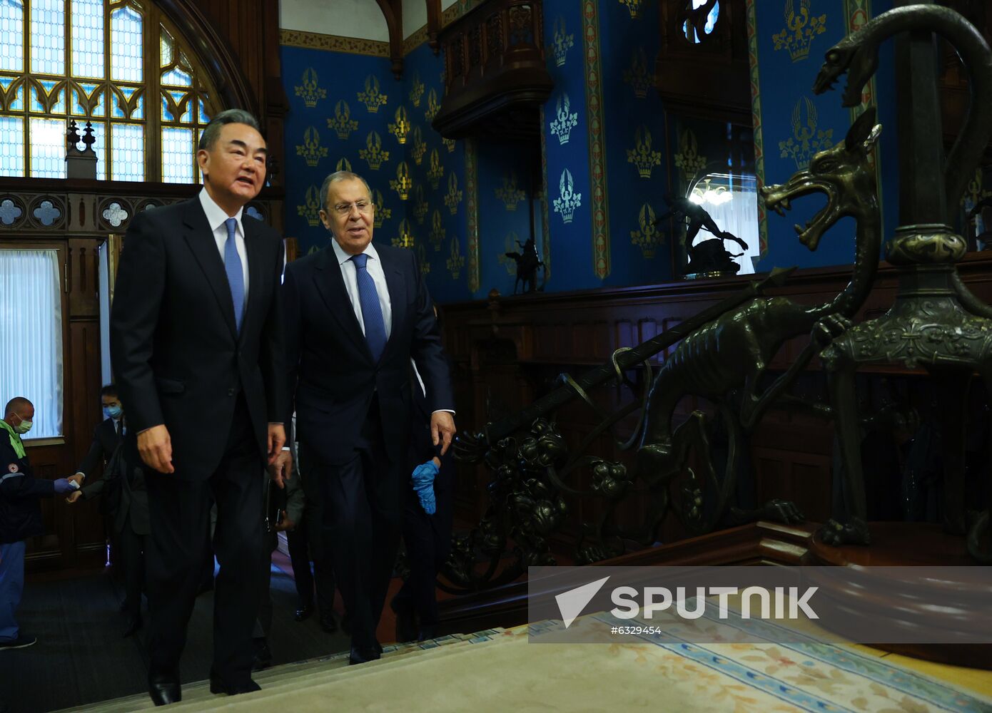 In this handout photo released by Russian Foreign Ministry, Russian Foreign Minister Sergei Lavrov and his Chinese counterpart Wang Yi walk up stairs before their meeting in Moscow, Russia. Editorial use only, no archive, no commercial use. Location: Russia, Moscow. Russia China