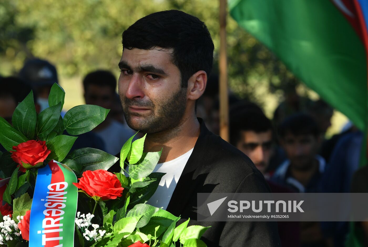 A man cries during a funeral ceremony for a serviceman who died in action, in a village near the combat zone, in Azerbaijan. A fresh spark in the conflict between Armenia and Azerbaijan in the disputed Nagorno-Karabakh region occurred on September, 27. Yerevan and Baku both accused each other of violating the 1994 ceasefire and causing civilian casualties. Location: Azerbaijan. Author: Mikhail Voskresenskiy/Sputnik. Azerbaijan Armenia Escalation