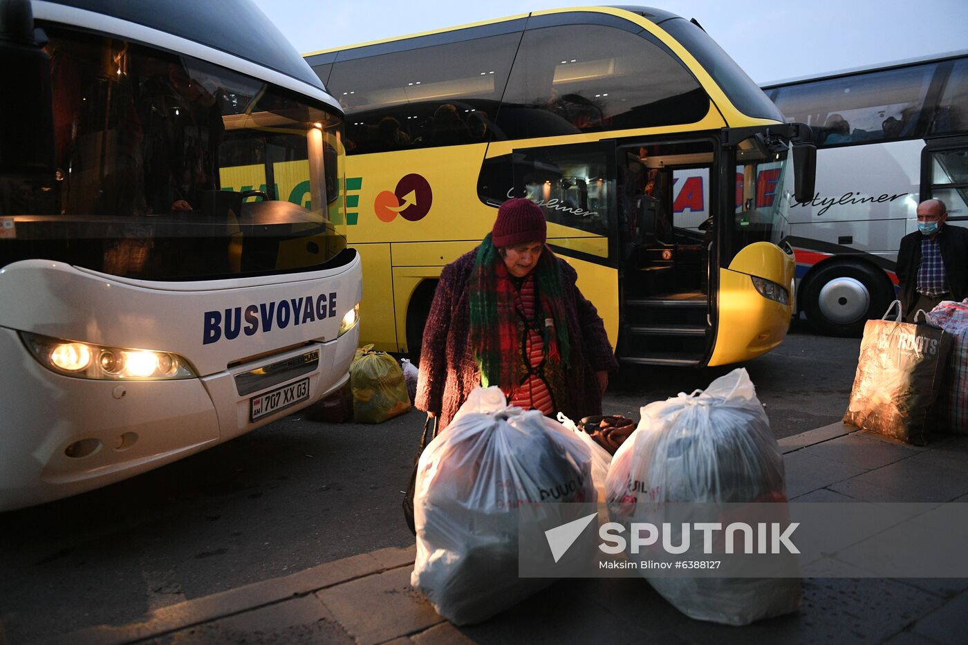 An elderly woman, who left for Armenia during the escalation of the conflict, cries as she waits for a bus to return to Stepanakert, in Yerevan, Armenia. On November 10, Armenian Prime Minister Nikol Pashinyan, Azerbaijani President Ilham Aliyev and Russian President Vladimir Putin signed a joint declaration on a new ceasefire in Nagorno-Karabakh. Baku and Yerevan have agreed to stop all hostilities in Karabakh starting November, 11. Free buses started running from Yerevan to Stepanakert for those returning to Karabakh on November 13. Location: Armenia, Yerevan. Author: Maksim Blinov/Sputnik. Azerbaijan Armenia Ceasefire