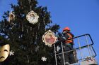 A municipal worker decorates a New Year Tree installed near the Northern River Station for the upcoming New Year and Christmas season, in Moscow, Russia. Location: Russia, Moscow. Author: Kirill Kallinikov/Sputnik. Russia New Year Preparations