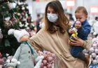 A customer wearing a face mask chooses Christmas decorations at a department store, in Simferopol, Russia. Location: Russia, Crimea region, Simferopol. Author: Konstantin Mihalchevskiy/Sputnik. Russia New Year Preparations