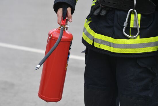 Using fire extinguisher