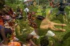 In this multiple exposure picture young people take part in the Jaran Kepang ritual, in Medan, Indonesia. Jaran Kepang, or Kuda Lumping, is a traditional Javanese dance depicting a group of horsemen. Dancers "ride" horses made from woven bamboo and decorated with colorful paints and cloth. When the dancer is performing the dance in trance conditions, he can display unusual abilities, such as eating glass and resistance to the effects of whipping or hot coals. Location: Indonesia, Medan. Author: Aditya Sutanta/Sputnik. Indonesia Kuda Lumping Dance