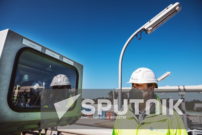 A Nord Stream 2 employee works on a platform in the Nord Stream 2 Baltic Sea pipeline's receiving station, where six and a half million cubic meters of natural gas per hour will be processed and delivered to downstream pipelines at the right pressure, in Lubmin, Germany. Location: Germany, Lubmin. Author: Dmitrij Leltschuk/Sputnik. Germany Nord Stream Gas Pipeline