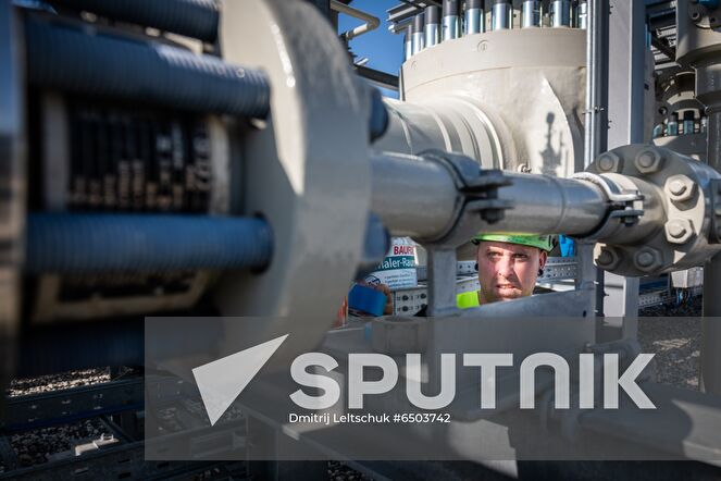 A Nord Stream 2 employee works on a platform in the Nord Stream 2 Baltic Sea pipeline's receiving station, where six and a half million cubic meters of natural gas per hour will be processed and delivered to downstream pipelines at the right pressure, in Lubmin, Germany. Location: Germany, Lubmin. Author: Dmitrij Leltschuk/Sputnik. Germany Nord Stream Gas Pipeline