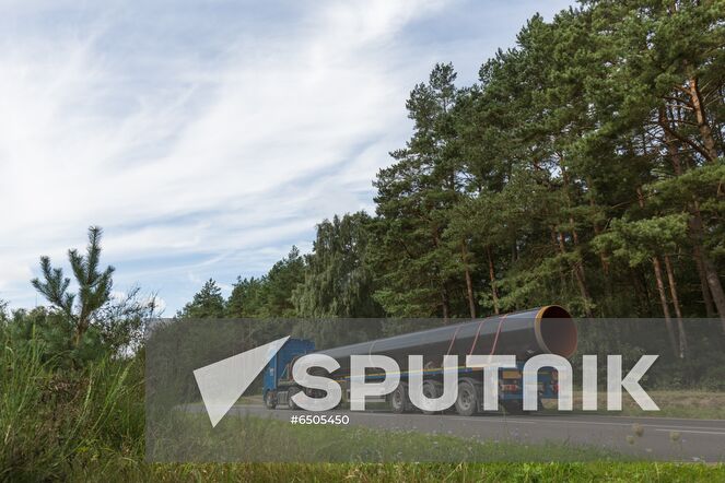 In this handout photo released by the press-service of Eugal, a truck brings a pipe to a nearby storage point, in Germany. The Eugal pipeline, which will receive gas from Nord Stream 2 in the future, has reached full pumping capacity, and the second line of the pipeline has been introduced. European gas pipeline link (EUGAL) is a 480km-long natural gas transport network being developed in order to strengthen the supply of natural gas to Germany and Europe. Editorial use only, no archive, no commercial use. Location: Germany. Germany Nord Stream Gas Pipeline