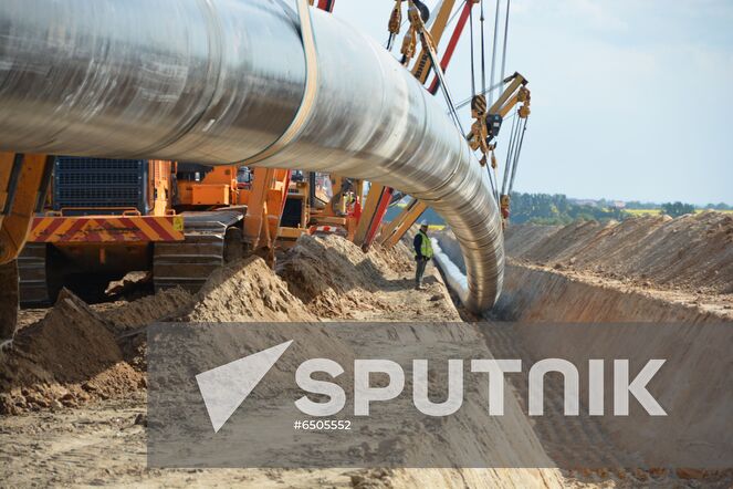 In this handout photo released by the press-service of Eugal, a view shows lowering of Eugal pipes, in Germany. The Eugal pipeline, which will receive gas from Nord Stream 2 in the future, has reached full pumping capacity, and the second line of the pipeline has been introduced. European gas pipeline link (EUGAL) is a 480km-long natural gas transport network being developed in order to strengthen the supply of natural gas to Germany and Europe. Editorial use only, no archive, no commercial use. Location: Germany. Germany Nord Stream Gas Pipeline