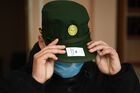 A conscript wearing protective face mask tries a cap on after getting his uniform at an assembly point of the military recruitment office amid coronavirus pandemic, in the town of Ob, Novosibirsk region, Russia. Location: Russia, Novosibirsk Region, Ob. Author: Alexandr Kryazhev/Sputnik. Russia Conscription