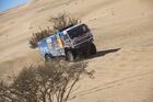 In this handout photo released by kamazmaster.ru, KAMAZ-Master's driver Anton Shibalov, co-driver Dmitry Nikitin and mechanic Ivan Tatarinov compete during the first stage of the Dakar rally from Jeddah to Al Wajh, in Saudi Arabia. Editorial use only, no archive, no commercial use. Location: Saudi Arabia. Saudi Arabia Dakar Kamaz