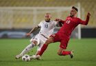 In this handout photo released by Russian Football Union, Turkey's Kenan Karaman, right, and Russia's Fyodor Kudryashov struggle for the ball during the Nations League soccer match between Turkey and Russia, in Istanbul, Turkey. Editorial use only, no archive, no commercial use. Location: Turkey, Istanbul. Author: Mikhail Shapayev/Sputnik. Turkey Soccer Nations League Turkey - Russia