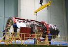 In this handout photo released by Russian Space Agency Roscosmos, the Soyuz MS-18 transport manned spacecraft is pictured as it is delivered to the assembly and test building site No. 254 after refueling with fuel components and compressed gas, at the Baikonur Cosmodrome, Kazakhstan. The emblem for the 60th anniversary of the first ever human flight into space includes the profile and autograph of Yuri Gagarin and is placed on the Soyuz-2.1 launch vehicle. The launch of the Soyuz a carrier rocket with the Soyuz MS-18 manned spacecraft, named after Gagarin, is scheduled for April 9. Editorial use only, no archive, no commercial use. Location: Kazakhstan, Baikonur. Kazakhstan Russia Space