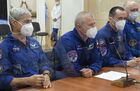 In this handout photo released by Russian Space Agency Roscosmos, from left, NASA astronaut Mark Vande Hai, Roscosmos cosmonauts Oleg Novitsky and Pyotr Dubrov, members of the ISS-65 prime crew, speak behind a glass wall after checking the final configuration of the Soyuz MS-18 spacecraft named after Soviet cosmonaut Yuri Gagarin at the Baikonur cosmodrome, Kazakhstan. Editorial use only, no archive, no commercial use. Location: Baikonur. Kazakhstan Russia Space