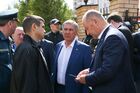 In this handout photo released by the Tatarstan's Presidential Press Office, Tatarstan's regional President Rustam Minnikhanov, centre, is pictured at the scene of a shooting at Gymnasium No. 175 in Kazan, Russia's Republic of Tatarstan. At least nine people, including seven children, were killed in the school shooting, while 20 more people were hospitalized with injuries. A former student of the Gymnasium No. 175, 19-year-old male who started shooting at the educational institution was detained earlier in the day. Editorial use only, no archive, no commercial use. Location: Russia, Republic of Tatarstan, Kazan. Russia School Shooting