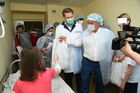 In this handout photo released by the Tatarstan's Presidential Press Office, Tatarstan's regional President Rustam Minnikhanov visits the Kazan republican children's clinical hospital, where the wounded children were hospitalized after shooting at the Gymnasium No. 175 in Kazan, Russia's Republic of Tatarstan. At least nine people, including seven children, were killed in the school shooting, while 20 more people were hospitalized with injuries. A former student of the Gymnasium No. 175, 19-year-old male who started shooting at the educational institution was detained earlier in the day. Editorial use only, no archive, no commercial use. Location: Russia, Republic of Tatarstan, Kazan. Russia School Shooting