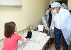 In this handout photo released by the Tatarstan's Presidential Press Office, Tatarstan's regional President Rustam Minnikhanov visits the Kazan republican children's clinical hospital, where the wounded children were hospitalized after shooting at the Gymnasium No. 175 in Kazan, Russia's Republic of Tatarstan. At least nine people, including seven children, were killed in the school shooting, while 20 more people were hospitalized with injuries. A former student of the Gymnasium No. 175, 19-year-old male who started shooting at the educational institution was detained earlier in the day. Editorial use only, no archive, no commercial use. Location: Russia, Republic of Tatarstan, Kazan. Russia School Shooting