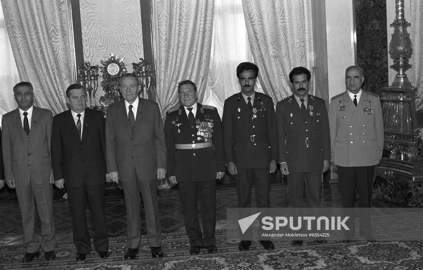 Presenting awards to Soviet-Afghan crew of Soyuz TM-6