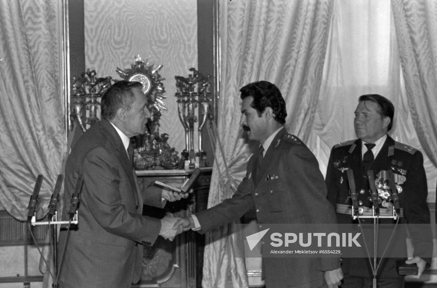 Presenting awards to Soviet-Afghan crew of Soyuz TM-6