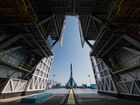 In this handout photo released by Russian Space Agency Roscosmos, the Soyuz-2.1b carrier rocket with the Fregat upper stage and 36 space vehicles of the OneWeb satellite company is erected at a launch pad ahead of its upcoming launch scheduled for July 1 at the Vostochny Cosmodrome, Amur region, Russia. Editorial use only, no archive, no commercial use. Location: Russia, Amur region. Russia Space