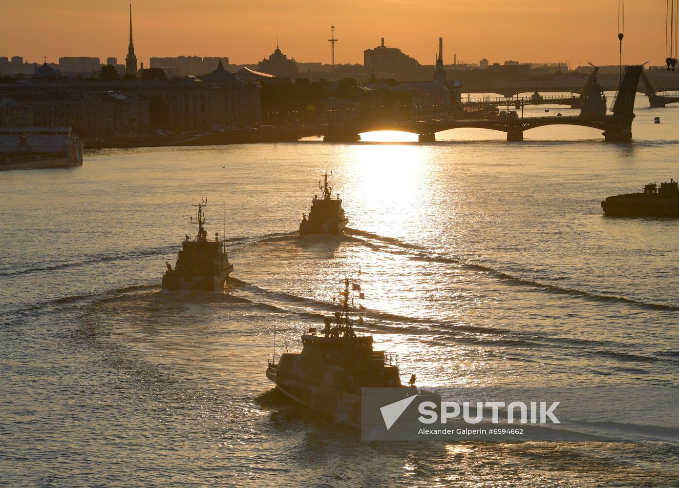 Warships sail on Neva River during a rehearsal of the naval parade marking the Russian Navy Day in St. Petersburg, Russia. Location: Russia, Saint Petersburg. Author: Alexander Galperin/Sputnik. Russia Navy Day Parade Rehearsal