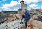 A man sits outside the ruins of a house destroyed by a wildfire in the village of Dzhabyk, in the Chelyabinsk region, Russia. Hundreds of residents were evacuated on Friday as strong winds complicated efforts to control the blaze, which spread across 14,000 hectares (35,000 acres) in the area some 1,500 kilometers (930 miles) east of the capital, Moscow.
Location: Russia, Chelyabinsk Region. Author: Aleksandr Kondratuk/Sputnik. Russia Wildfires