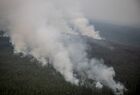 Smoke rises from a wildfire in Gorny District, Russia's Sakha Republic (Yakutia). Region authorities have registered 273 active wildfires in the region, 2161 people and about 300 units of machinery are involved in battling the fires. Location: Russia, Republic of Sakha (Yakutia). Author: Andrey Sorokin/Sputnik. Russia Wildfires