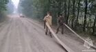 In this handout video grab released by the Russian Emergency Situations Ministry, firefighters work at a site of a forest fire in Russia's Republic of Karelia. Editorial use only, no archive, no commercial use. Location: Russia, Republic of Karelia. Russia Wildfires