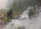 A firefighter tries to extinguish a wildfire in Gorny District, Republic of Sakha (Yakutia), Russia. Region authorities have registered 273 active wildfires in the region, 2161 people and about 300 units of machinery are involved in battling the fires. Location: Russia, Republic of Sakha (Yakutia). Author: Andrey Sorokin/Sputnik. Russia Wildfires