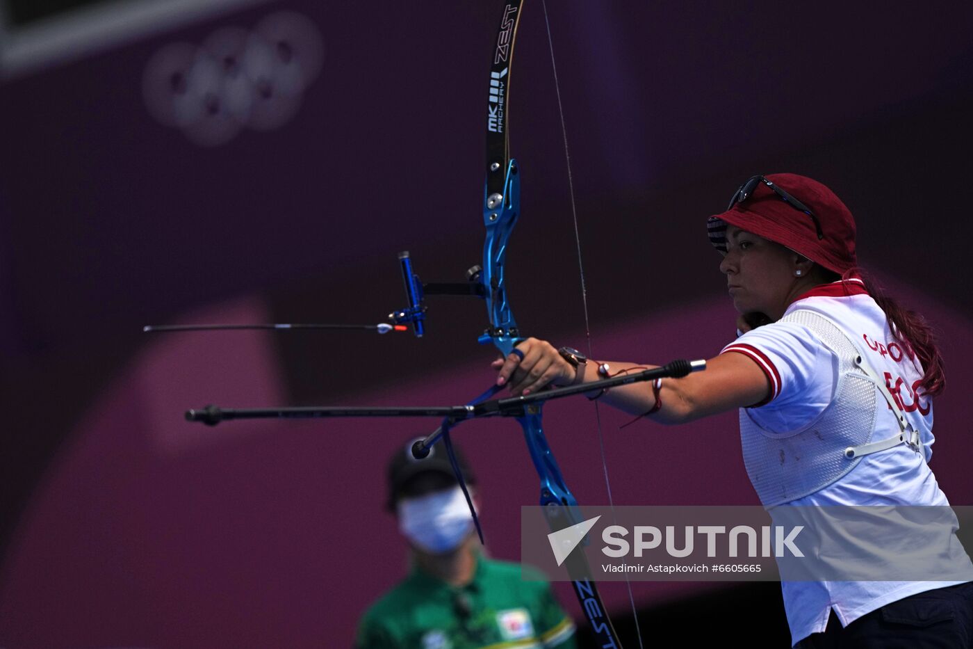 Russian Olympic Committee's Elena Osipova competes during the archery women's team quarterfinal match between United States and Russian Olympic Committee (ROC) team at the Tokyo 2020 Olympic Games at Yumenoshima Final Field, in Tokyo, Japan. Location: Japan, Tokyo. Author: Vladimir Astapkovich/Sputnik. Japan Olympics 2020 Archery Women Team