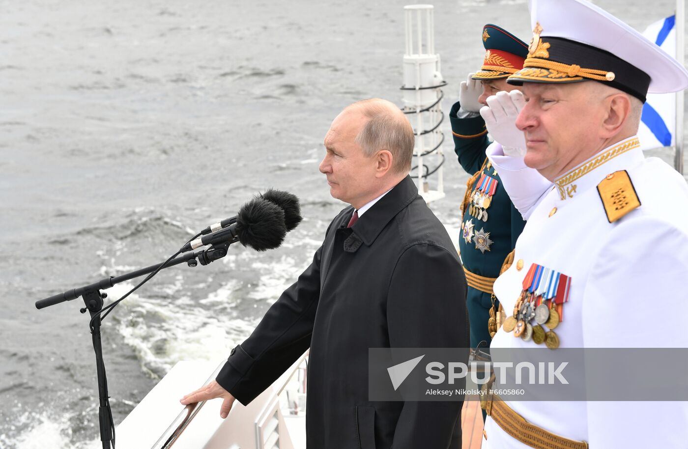 Russia's Defence Minister Sergei Shoigu, Russian Navy Commander-in-Chief Admiral Nikolai Yevmenov, and Russia's President Vladimir Putin review warships before the main naval parade marking Russian Navy Day in the Gulf of Finland, in St. Petersburg, Russia. Location: Russia. Author: Aleksey Nikolskyi/Sputnik. Russia Putin Main Navy Day Parade