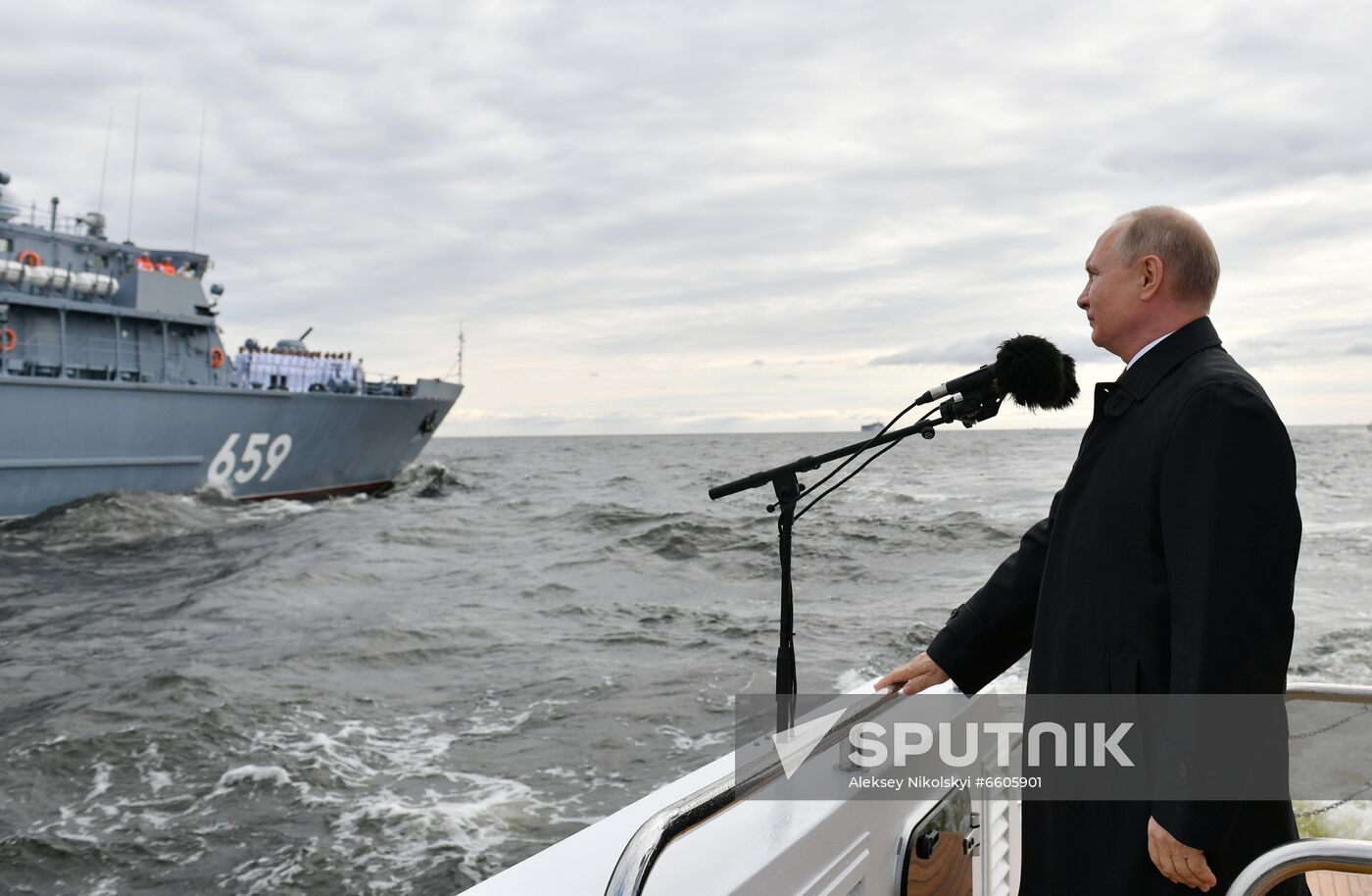 Russian President Vladimir Putin reviews warships before the main naval parade marking Russian Navy Day in the Gulf of Finland, in St. Petersburg, Russia. Location: Russia. Author: Aleksey Nikolskyi/Sputnik. Russia Putin Main Navy Day Parade