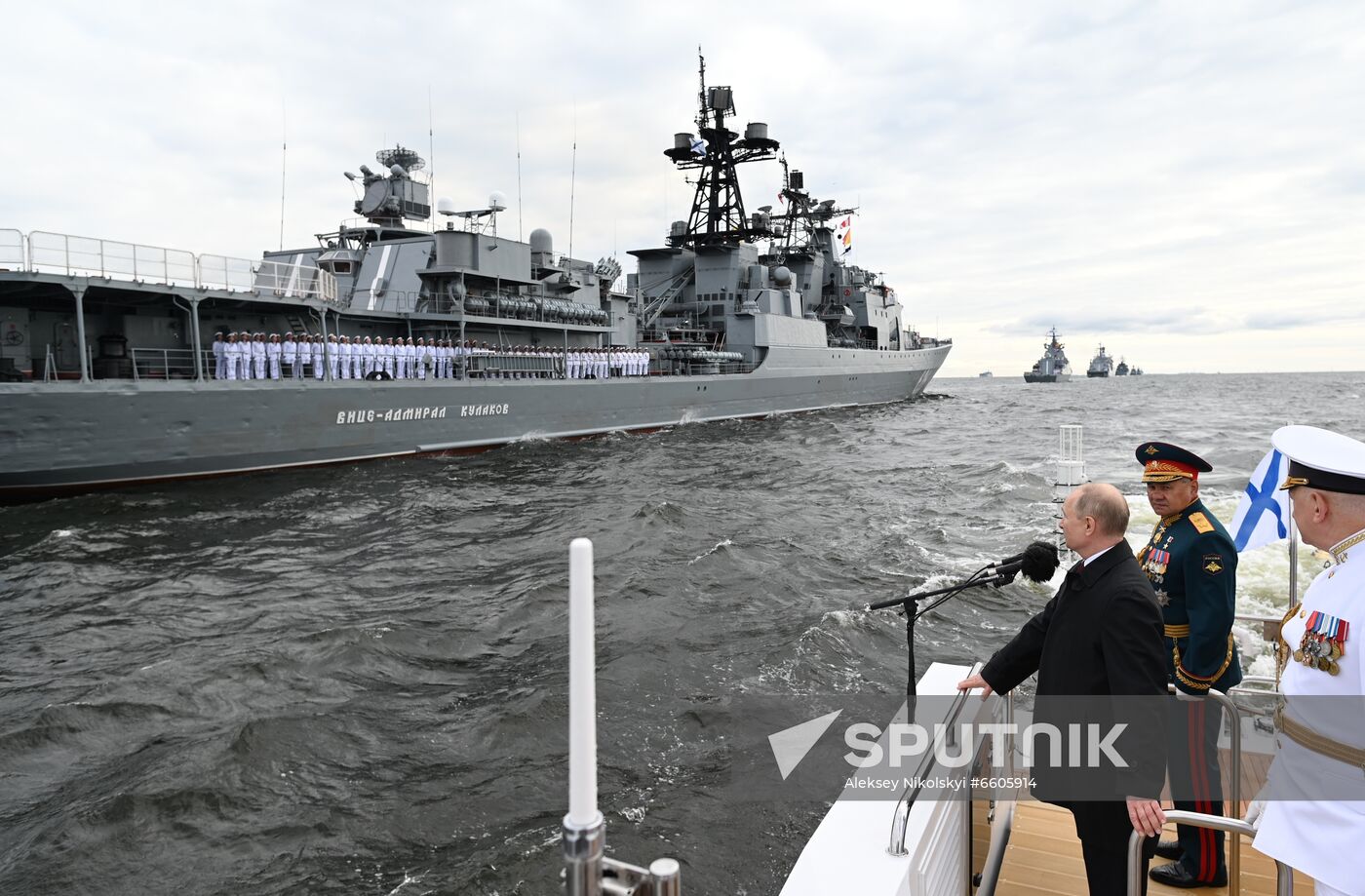 Russian President Vladimir Putin and Russia's Defense Minister Sergei Shoigu review warships before the main naval parade marking Russian Navy Day in the Gulf of Finland, in St. Petersburg, Russia. Location: Russia. Author: Aleksey Nikolskyi/Sputnik. Russia Putin Main Navy Day Parade