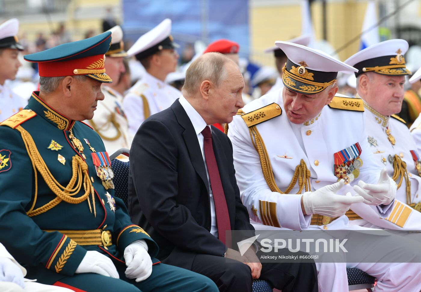 Russian Defense Minister Sergei Shoigu, Russian President Vladimir Putin, and Admiral Nikolai Yevmenov, Commander-in-Chief of the Russian Navy take part in a military parade in Senate Square on Russian Navy Day, in St. Petersburg, Russia. Location: Russia, St. Petersburg. Author: Aleksey Nikolskyi/Sputnik. Russia Putin Main Navy Day Parade