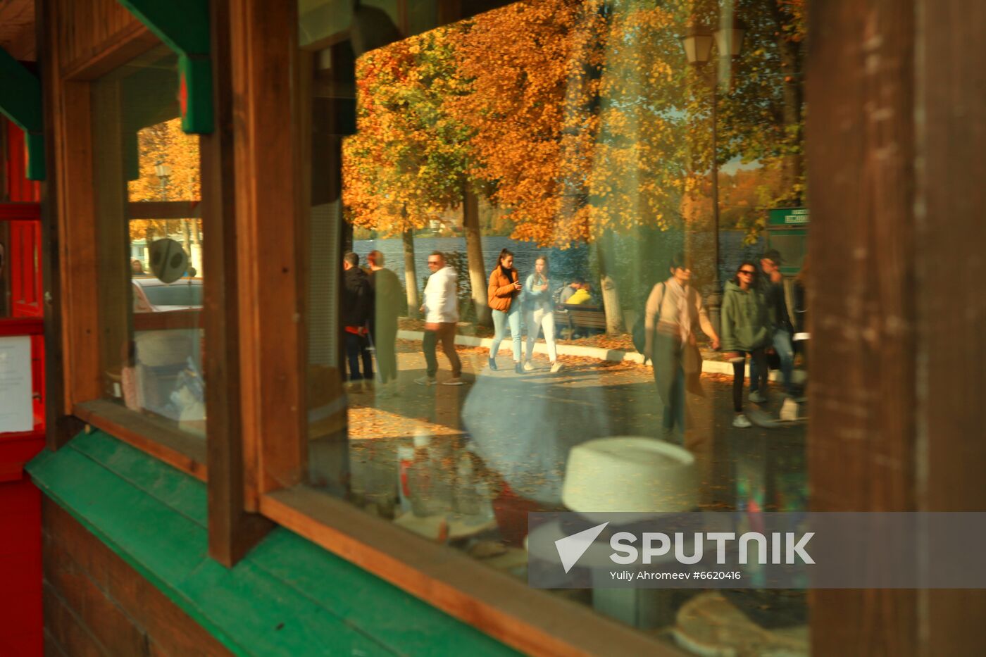 Embankment reflected in hat shop window in Plyos