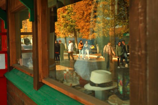 Embankment reflected in hat shop window in Plyos