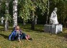 A man rests by a tree next to a sculpture of Russian poet Sergey Yesenin in Muzeon Park of Arts in Moscow, Russia. Location: Moscow. Author: Grigory Sysoev/Sputnik. Russia Daily Life