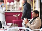 A man rests at a street cafe as sparrows sit on a chair at Manezhnaya square in Moscow, Russia. Location: Moscow. Author: Alexey Maishev/Sputnik. Russia Daily Life