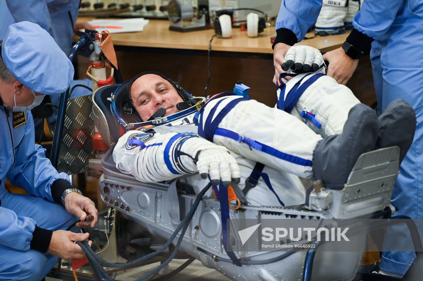 ISS Expedition 66 main crew member, Roscosmos cosmonaut Anton Shkaplerov puts on his spacesuit at the Baikonur Cosmodrome, in Baikonur, Kazakhstan. The launch of the Soyuz MS-19 mission to be involved in making the feature film "The Challenge" aboard the International Space Station is scheduled for 5 October 2021 at 11:55 Moscow time from the Baikonur Cosmodrome. Actor Yulia Peresild and director Klim Shipenko are set to blast off Tuesday for the International Space Station in a Russian Soyuz spacecraft together with cosmonaut Anton Shkaplerov, a veteran of three space missions. After 12 days on the space outpost, Peresild and Shipenko will return to Earth with another Russian cosmonaut. Location: Kazakhstan, Baikonur. Author: Ramil Sitdikov/Sputnik. Kazakhstan Russia Space