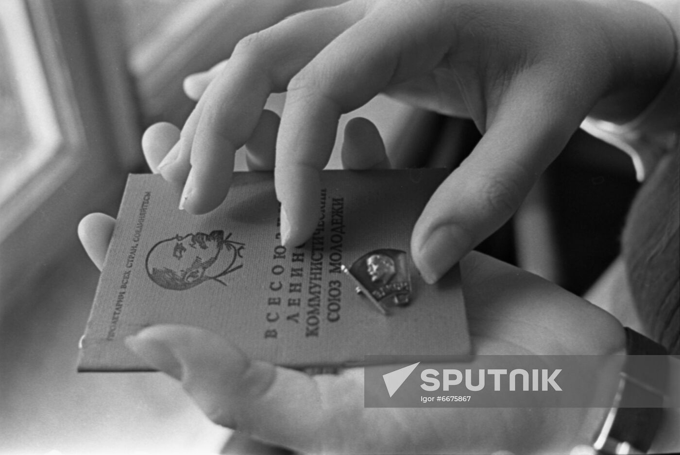 Komsomol badge and membership card