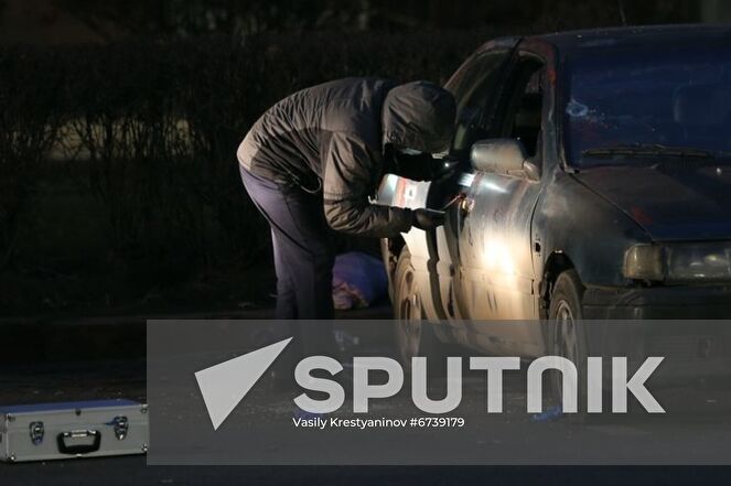 A police officer explores a broken-down car on a street in Almaty, Kazakhstan. Protests sparked by rising fuel prices, started in the towns of Zhanaozen and Aktau in western Kazakhstan on January 2 and spread rapidly across the country. On January 5, President Tokayev dismissed the government and declared a 2-week state of emergency in the Mangistau and Almaty regions, as well as in the cities of Almaty and Nur-Sultan. Location: Kazakhstan, Almaty. Author: Vasily Krestyaninov/Sputnik. Kazakhstan Protests Aftermath