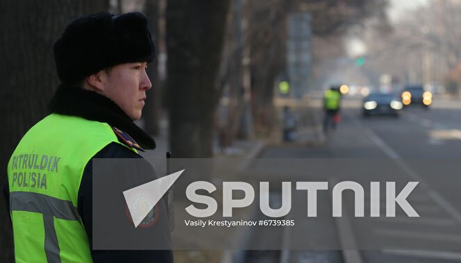 Police officer patrols the street of Almaty, Kazakhstan. Protests sparked by rising fuel prices, started in the towns of Zhanaozen and Aktau in western Kazakhstan on January 2 and spread rapidly across the country. On January 5, President Tokayev dismissed the government and declared a 2-week state of emergency in the Mangistau and Almaty regions, as well as in the cities of Almaty and Nur-Sultan. Location: Kazakhstan, Almaty. Author: Vasily Krestyaninov/Sputnik. Kazakhstan Protests Aftermath