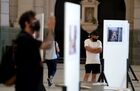 People walk among photos displayed during the opening ceremony of the Stenin Photo Contest exhibition at Retiro railway station, in Buenos Aires, Argentina. Andrei Stenin International Photo Contest for young photojournalists is named after special photo correspondent of the Rossiya Segodnya International Information Agency, who was killed while on assignment in the conflict-torn eastern Ukraine. Location: Argentina, Buenos Aires. Author: Ignasio Amikoni/Sputnik. Argentina Stenin Photo Contest