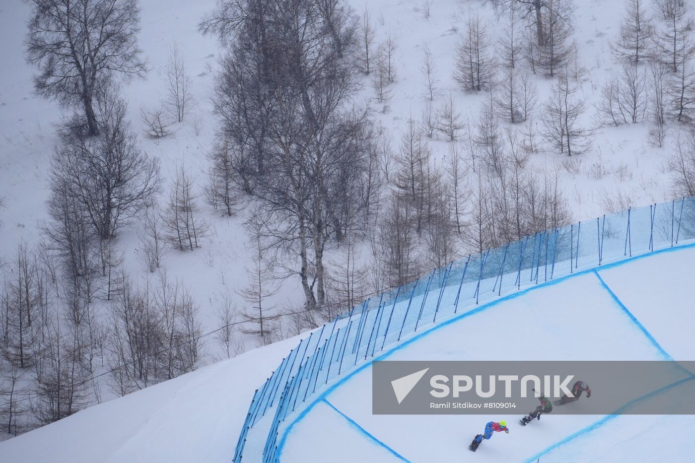 From left, Italy's Michela Moioli, Meghan Tierney, of the United States, and Switzerland's Lara Casanova compete in the women's snowboard cross 1/8 finals during the Beijing 2022 Winter Olympic Games at Genting Snow Park H & S Stadium in Zhangjiakou, China. Location: China, Zhangjiakou. Author: Ramil Sitdikov/Sputnik. China Olympics 2022 Snowboard Women