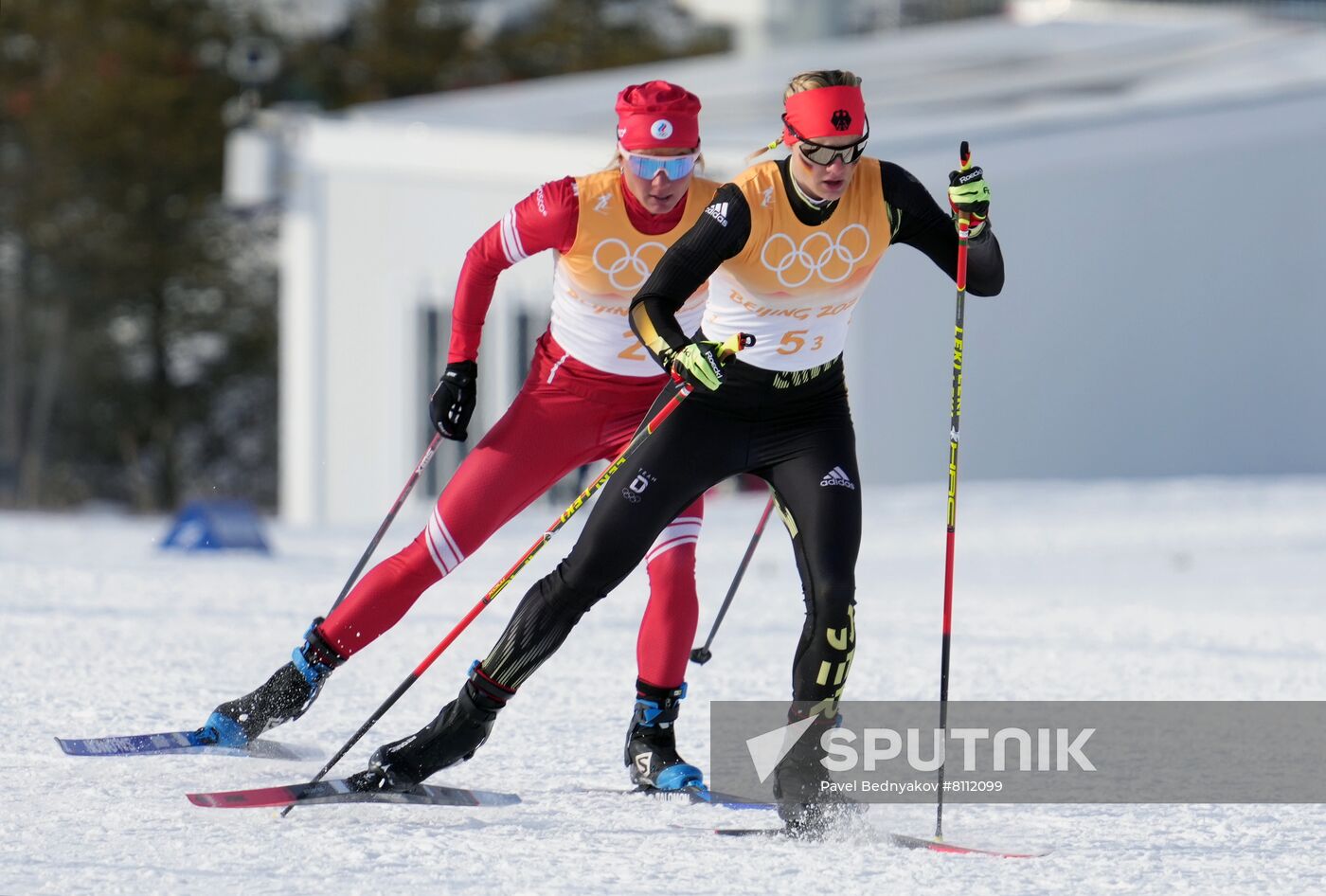 Germany's Victoria Carl, right, and Russian Olympic Committee's Tatiana Sorina compete in the women's cross-country 4x5 km relay event during the Beijing 2022 Winter Olympic Games at the National Cross-Country Skiing Centre in Zhangjiakou, China. Location: China, Zhangjiakou. Author: Pavel Bednyakov/Sputnik. China Olympics 2022 Cross-Country Skiing Women