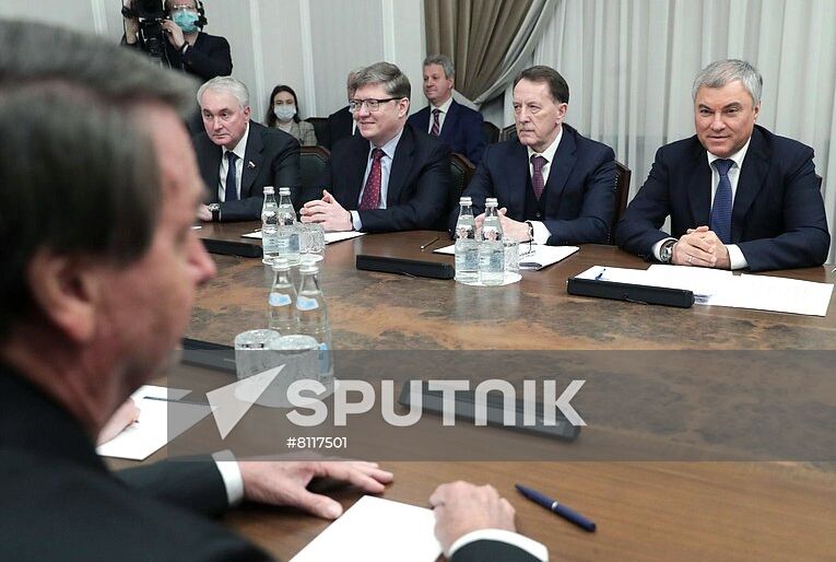 In this handout photo released by Russian State Duma, Russian lower chamber's chairman Viacheslav Volodin, right, and Brazilian President Jair Bolsonaro, left, attend a meeting at the State Duma, the lower house of the Russia's parliament, in Moscow, Russia. Editorial use only, no archive, no commercial use. Location: Russia, Moscow. Russia Brazil Parliament