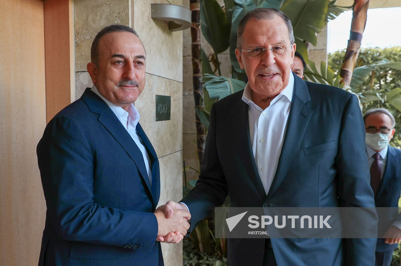 In this handout photo released by the Russian Foreign Ministry, Russian Foreign Minister Sergey Lavrov, right, and Turkish Foreign Minister Mevlut Cavusoglu shake hands after a meeting on the sidelines of Antalya Diplomacy Forum, in Antalya, Turkey. Editorial use only, no archive, no commercial use. Location: Turkey, Antalya. Turkey Antalya Diplomacy Forum Sideline Meetings